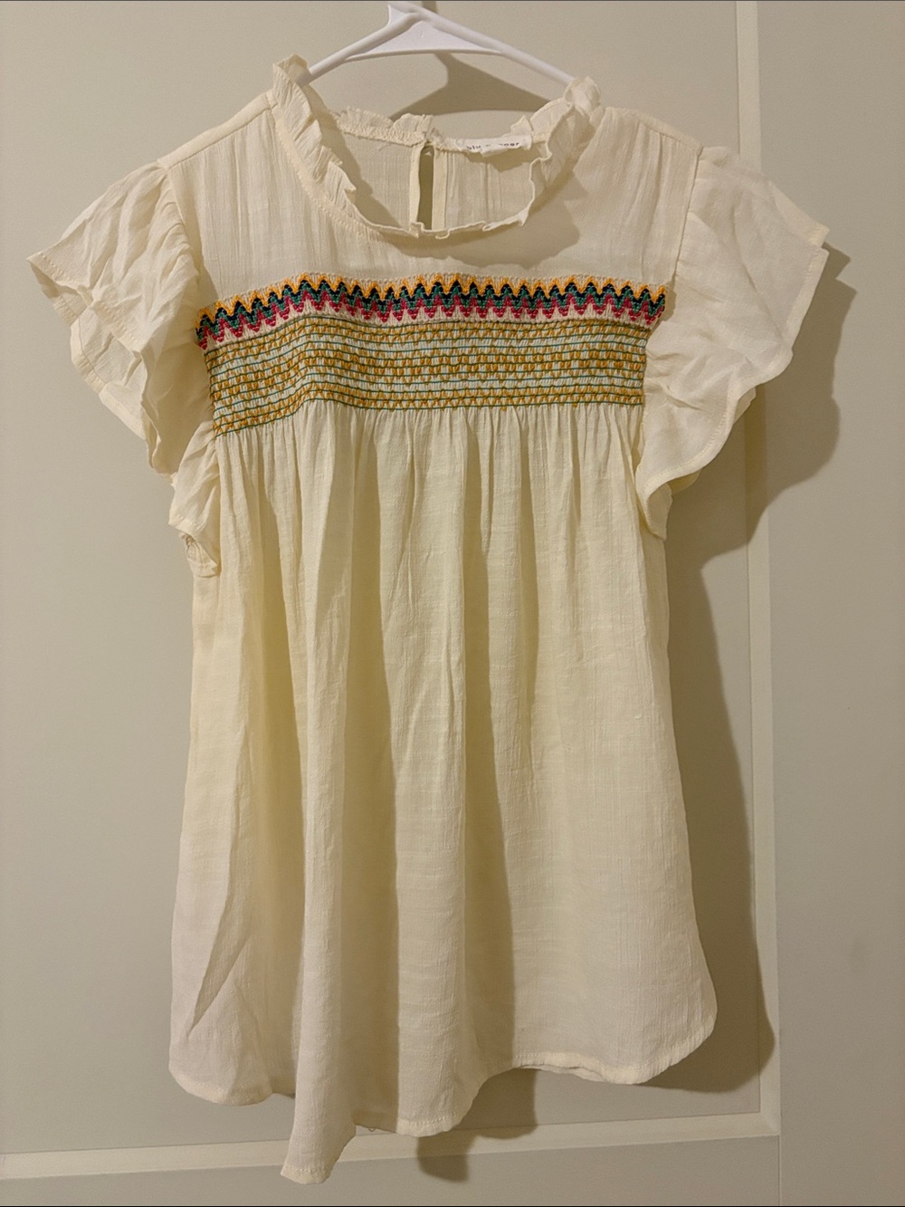 Blu Pepper Cream Smocked Flutter Tunic Top